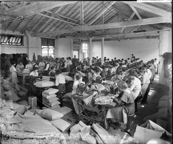 Making supplies for the military in the sewing workshops at Hampton’s factory, Lambeth, London. Bedford Lemere 1916 © Historic England. Images are from the National Monuments Record, and published in WORK (£9.99) from English Heritage’s The Way We Were series.