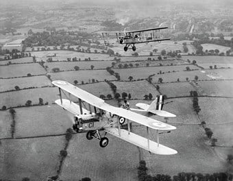 Two De Havilland DH9 biplanes fly in close formation during RAF Aerial