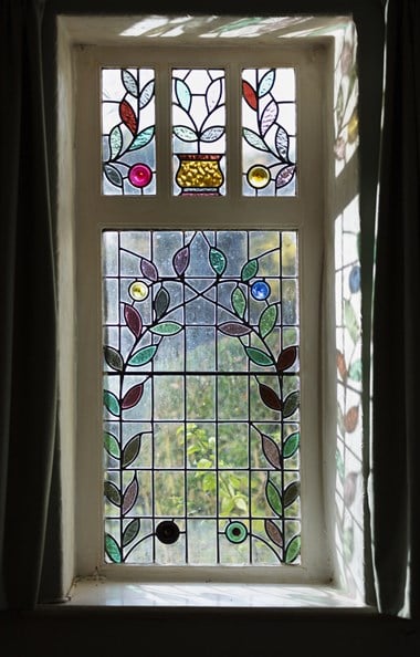 Stained glass window with floral design.