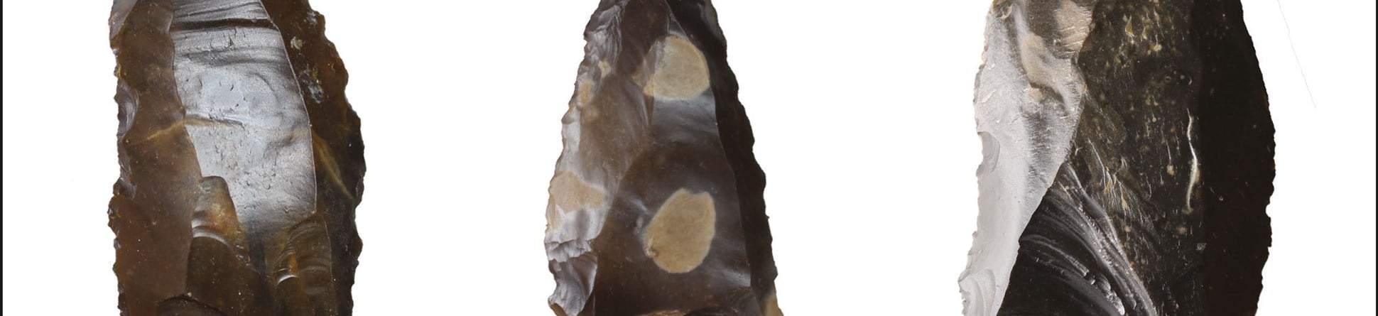 A photograph showing three views of stone tools.
