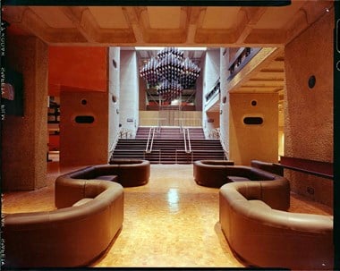 An interior photograph of the Barbican Centre showing bespoke furniture and fittings.
