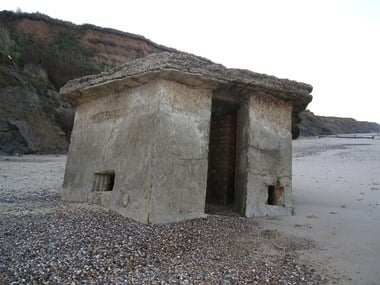 Happisburgh, Norfolk. This WWII pillbox was originally on top of the cliff.
