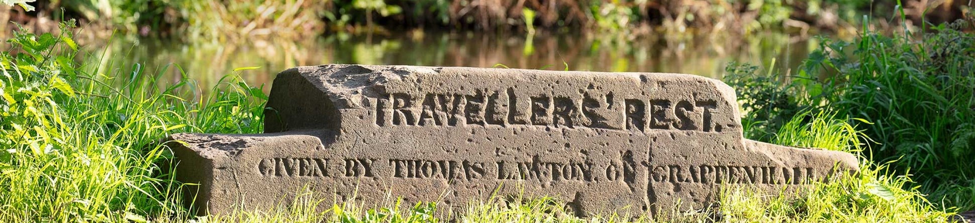 Stepped stone slab with the inscription 'Travellers' Rest / given by Thomas Lawton of Grappenhall / 1859'