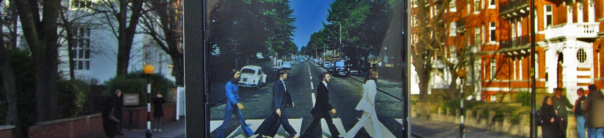 The famous zebra crossing near Abbey Road Studios and the Beatles Album cover "Abbey Road" which immortalised the street.