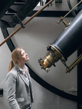 Anna Rolls looking up at the Airy Transit Circle telescope at the Royal Observatory.