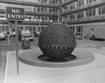Sculpture in the shape of a pineapple in car park
