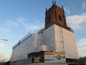 Chiurch covered in scaffolding and tarpaulin