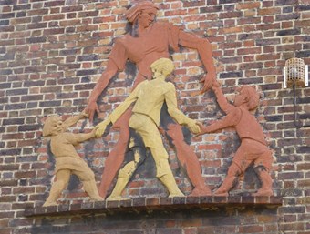 Relief of Mother and Children Playing by Peter Laszlo Peri, 1951-2. Horton House, South Lambeth Estate, Fentiman Road, London. Listed Grade II © Historic England