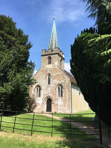 Image of St Nicholas Church made of stone with a spire