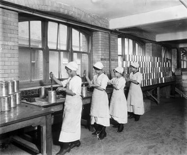 Cadby Hall food factory, Hammersmith, London, September 1918. Workers at Cadby Hall, owned by the then fledgling J. Lyons company, producing Christmas puddings for the troops
