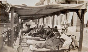 Wrest Park, near Luton, Bedfordshire. Convalescent soldiers resting under awnings in the open air outside the house. (DP087630) © Private Collection