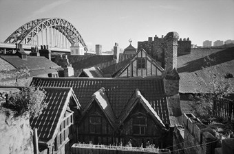 The rear of Bessie Surtees House, with the Tyne Bridge in the background