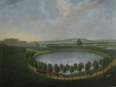 Painting of large lake surrounded by trees in parkland with a large house in the background