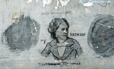 Detail of historic graffiti  featuring a portrait of a Woman in early 20th century clothing labelled "My Kathleen". Other female names are written nearby : "Annie Wainwright" and another that has been crossed through beginning "Miss..."