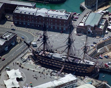 Overhead view of a sailing ship in dry dock.