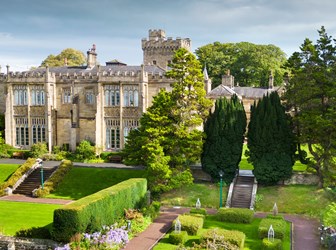 Exterior, drone image of Capernwray Hall and its formal 'Mawson' rose garden. View from west. 
