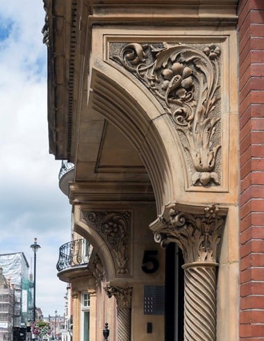 Exterior decorative door columns and brackets.