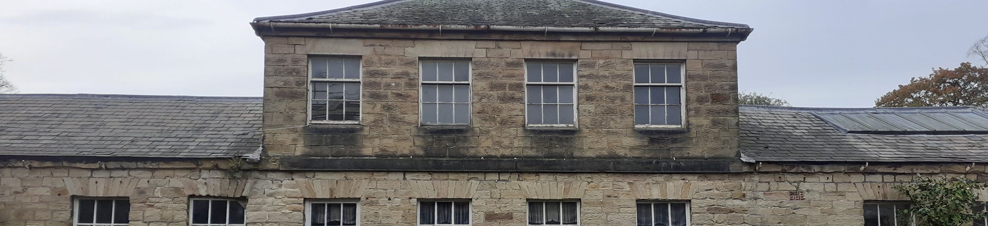 An old two storey stone building.