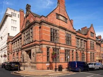A red-brick two-storey building on Margaret Street, with the name "Birmingham & Midlands Institute". 