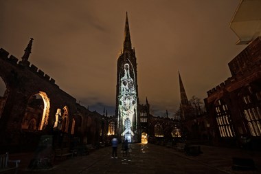 Image of brass rubbing projected onto the cathedral building