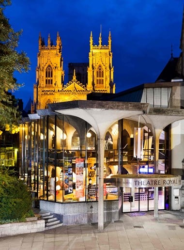 Entrance to theatre with York Minster lit up in the background