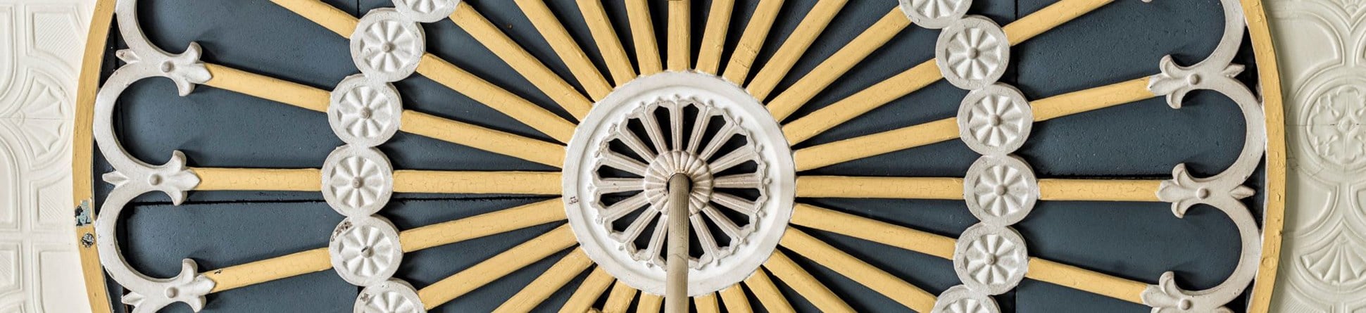 Decorative ceiling rose painted yellow and blue