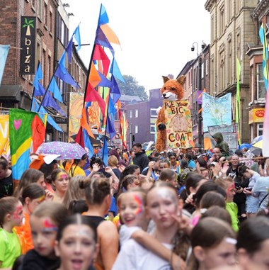 A crowd at a street carnival in Wigan.